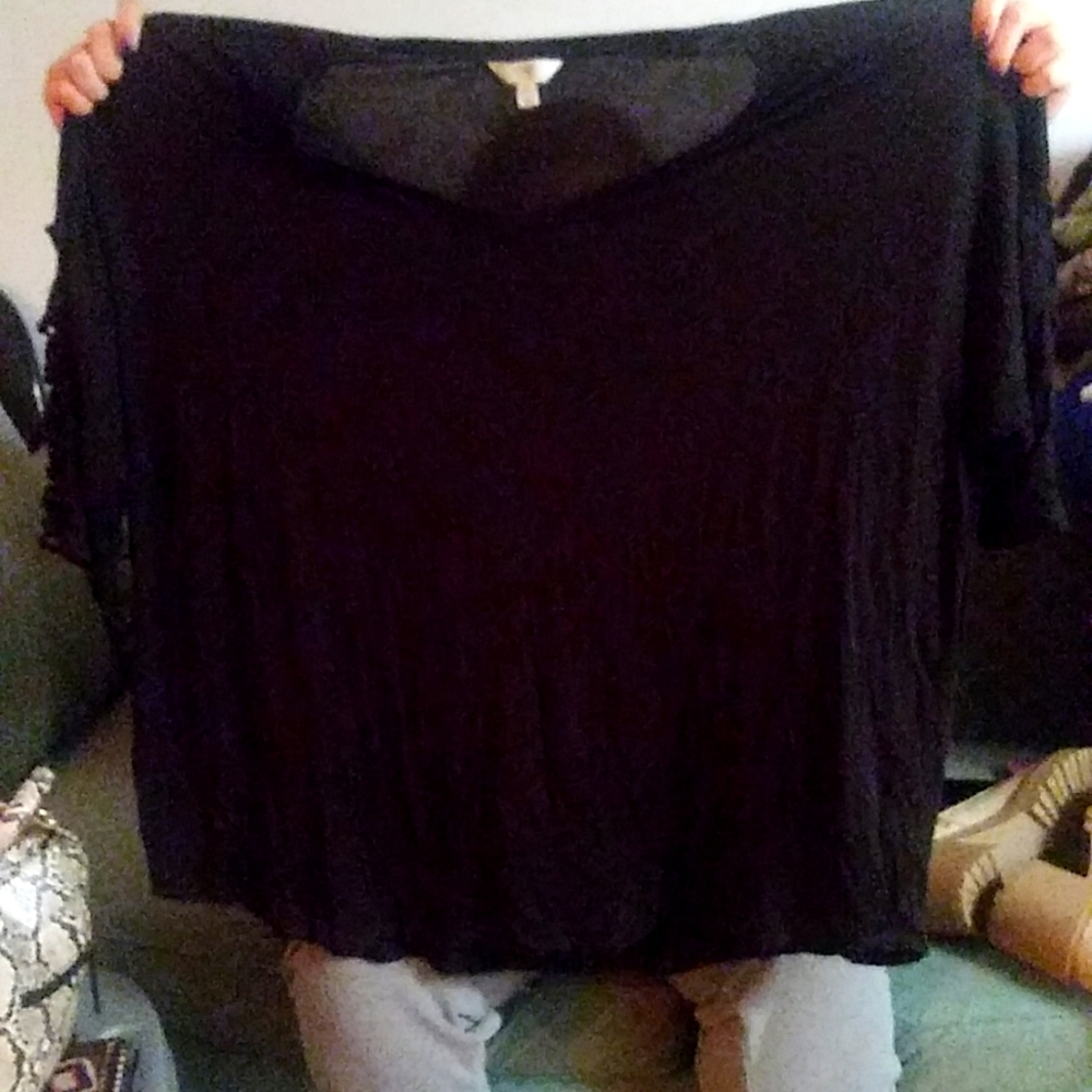 Black 3/4 length sleeve shirt with criss crossed sleeves